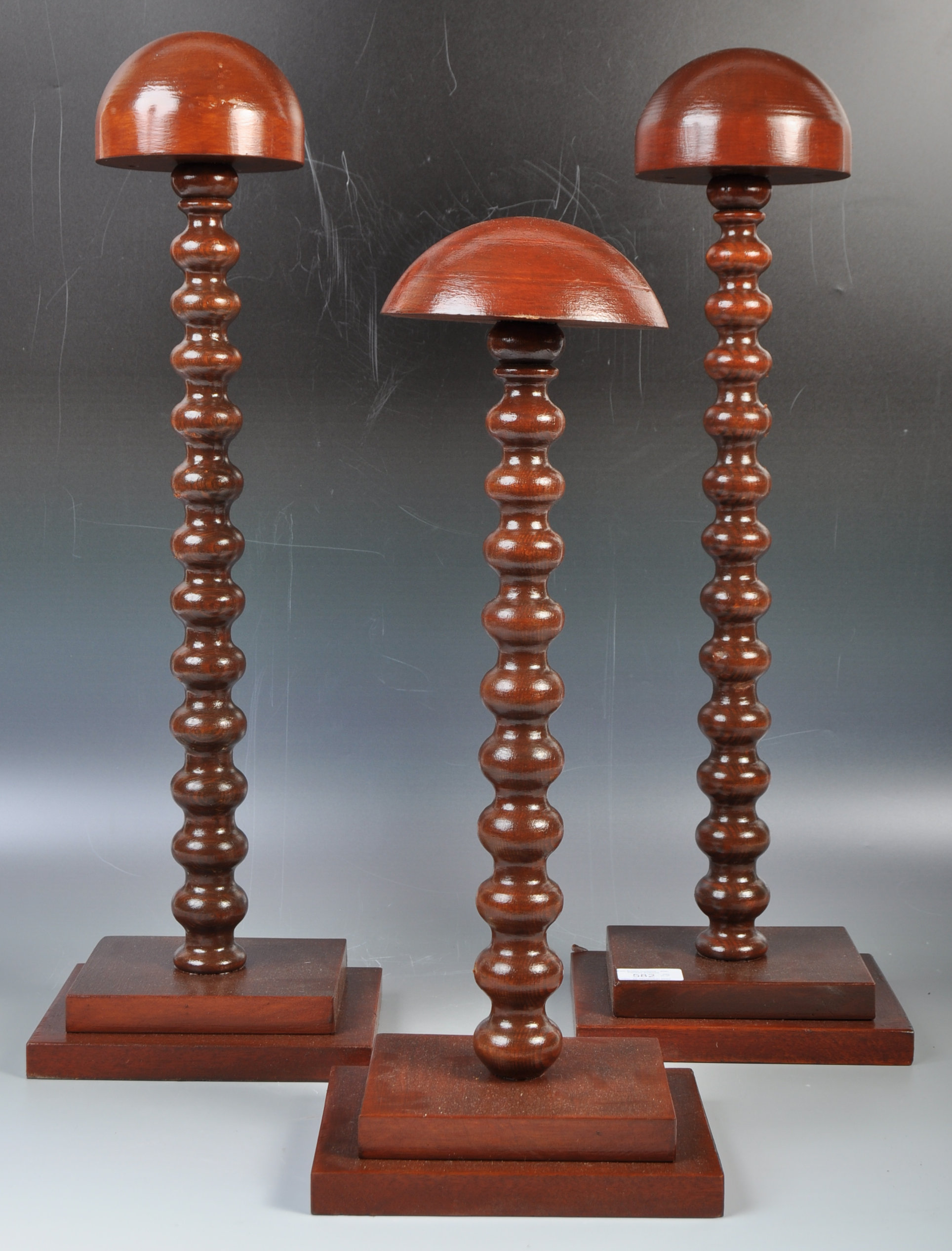 GROUP OF THREE MAHOGANY SHOP / HABERDASHERY HAT DISPLAY STANDS