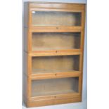 EARLY 20TH CENTURY FOUR SECTION LAWYERS STACKING BOOKCASE BY GUNN