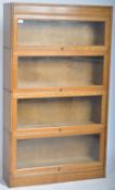 EARLY 20TH CENTURY FOUR SECTION LAWYERS STACKING BOOKCASE BY GUNN