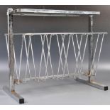 1960'S ART DECO TYPE CHROME MAGAZINE RACK IN MILO BAUGHMAN MANNER