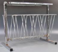 1960'S ART DECO TYPE CHROME MAGAZINE RACK IN MILO BAUGHMAN MANNER