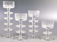 GRADUATING SET OF SHERINGHAM CLEAR GLASS CANDLESTICKS