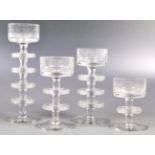 GRADUATING SET OF SHERINGHAM CLEAR GLASS CANDLESTICKS