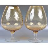 LARGE PAIR OF AMBER GLASS EMPOLI BRANDY GLASSES