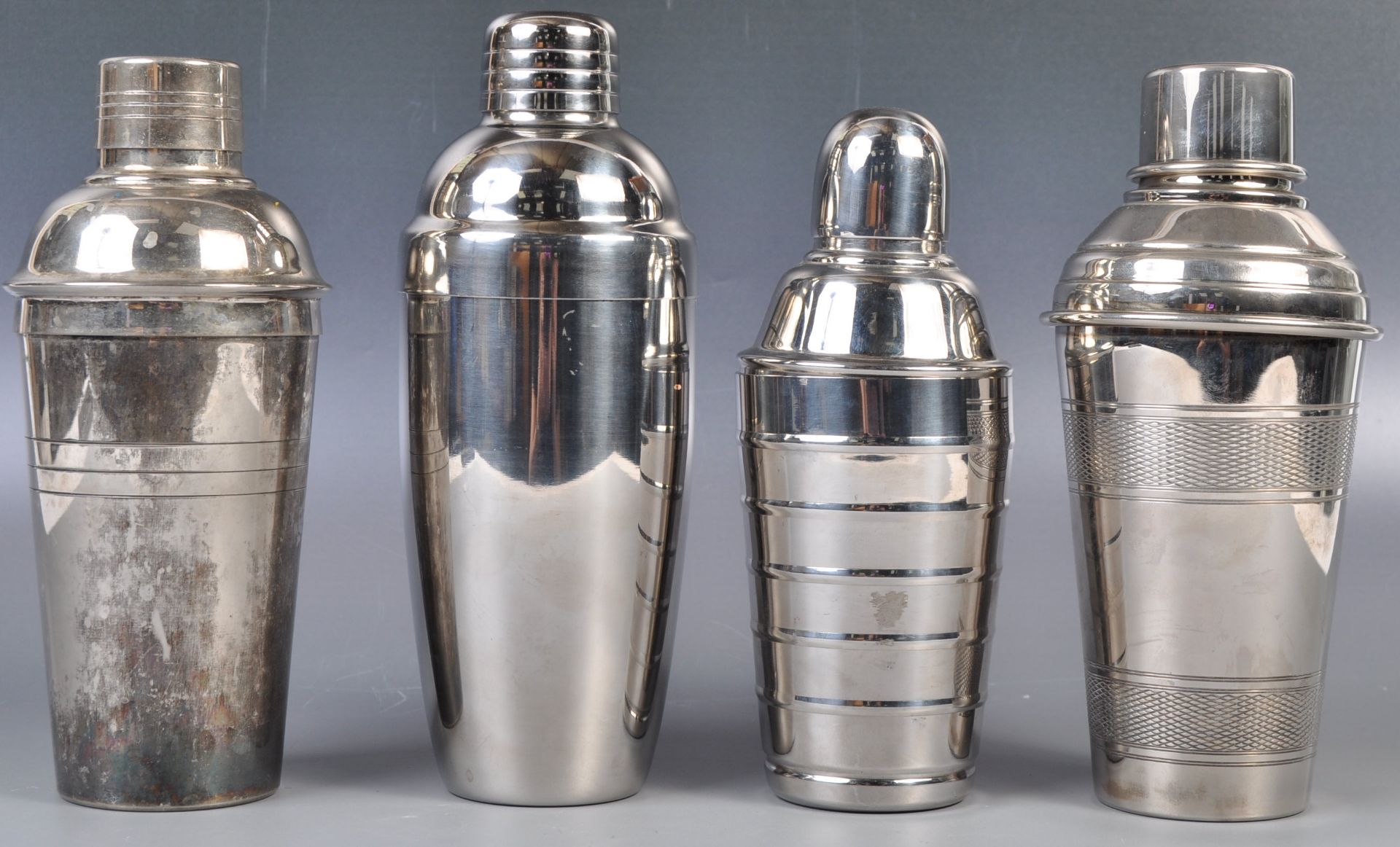 GROUP OF FOUR 20TH CENTURY COCKTAIL SHAKERS INCLUDING TWO ART DECO EXAMPLES