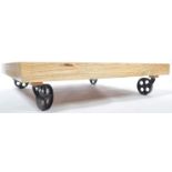 GOOD CONTEMPORARY MANGO WOOD COFFEE TABLE RAISED ON METAL WHEELS