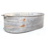 A RETRO 20TH CENTURY RECLAMATION YARD GALVANISED BATH