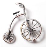 A STAMPED 925 SILVER FIGURE OF A PENNY FARTHING BICYCLE.