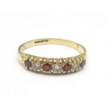 9CT GOLD AND RED STONE RING