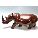 LARGE AND IMPRESSIVE HAND CARVED ROSEWOOD RHINO