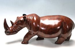 LARGE AND IMPRESSIVE HAND CARVED ROSEWOOD RHINO