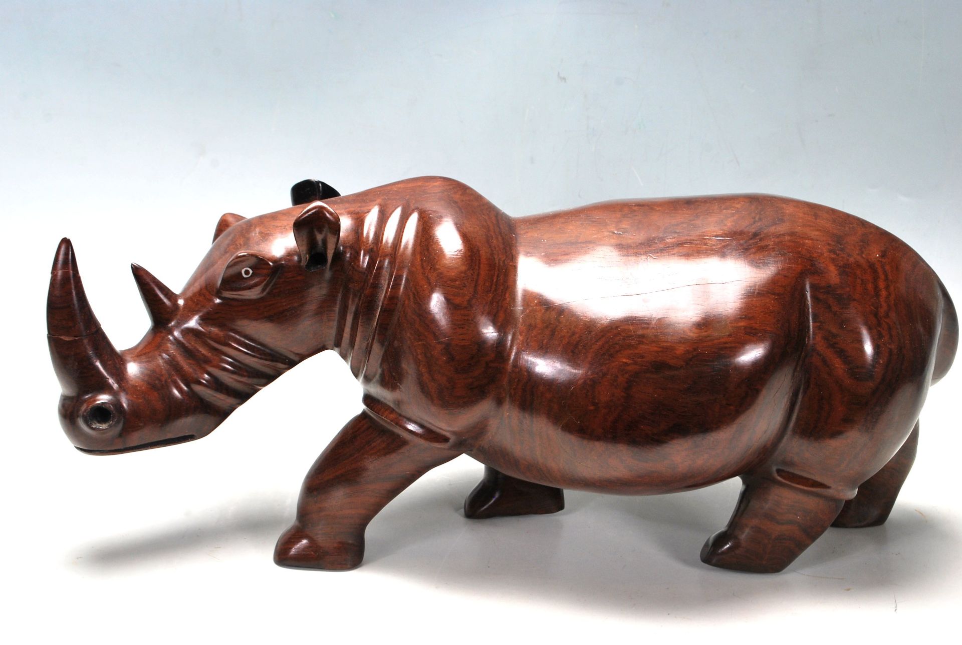 LARGE AND IMPRESSIVE HAND CARVED ROSEWOOD RHINO