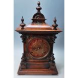 AN ANTIQUE AMERICAN WALNUT CASE MANTLE CLOCK