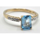 9CT GOLD AND BLUE STONE DRESS RING