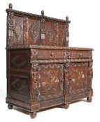 A 19TH CENTURY CARVED OAK SIDEBOARD - DRESSER