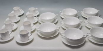 A VINTAGE WEDGEWOOD COUNTRYWARE TEA SERVICE TO INCLUDE CUP AND SAUCERS AND SOUP BOWLS.