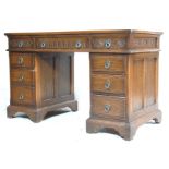 ANTIQUE STYLE OAK AND RED LEATHER TWIN PEDESTAL DESK
