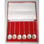 SET OF SIX 1975 SILVER HALLMARKED AND ENAMELLED COFFEE SPOONS IN A FITED CASE