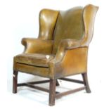EARLY 20TH CENTURY CHESTERFIELD STYLE WINGBACK ARMCHAIR