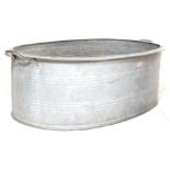 A RETRO 20TH CENTURY RECLAMATION GALVANISED BATH