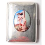 A SILVER HALLMARKED CIGARETTE CASE HAVING AN ENAMEL OVAL PANEL DEPICTING A NUDE STUDY.