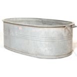 RETRO 20TH CENTURY RECLAMATION GALVANISED BATH OF AN OVAL FORM