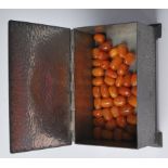 LOOSE BUTTERSCOTCH AMBER BEADS IN PEWTER BOX
