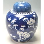 19TH CENTURY CHINESE GINDER JAR PAINTED IN BLUE AND WHITE PRUNUS PATTERN