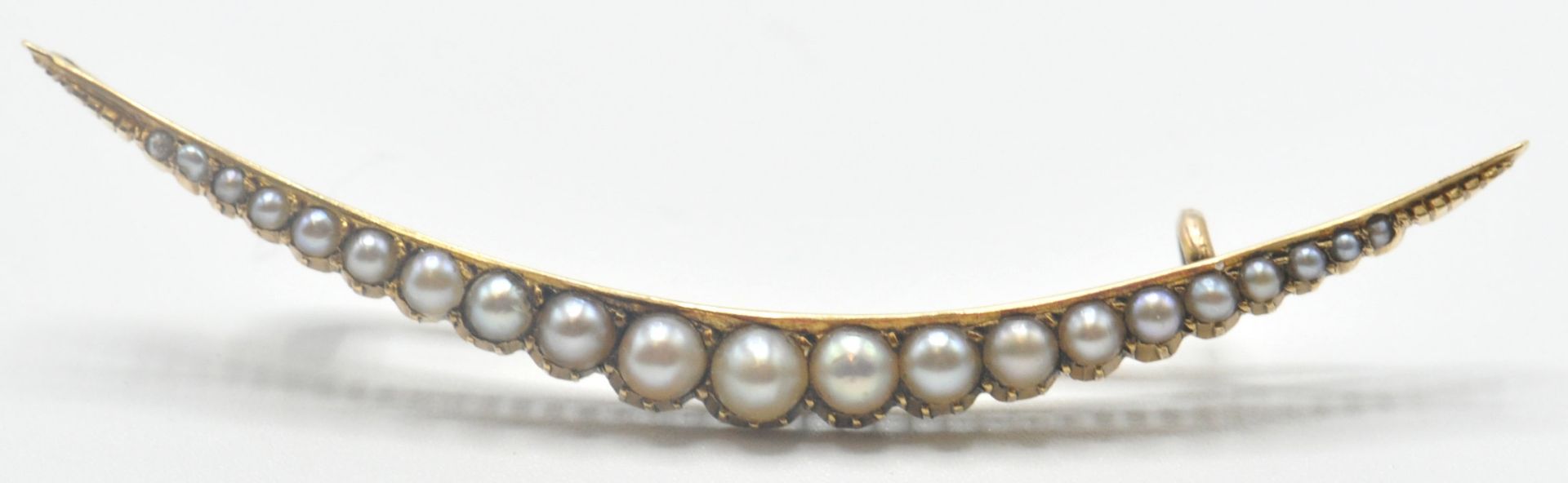 EDWARDIAN GOLD AND HALF PEARL CRESCENT BROOCH