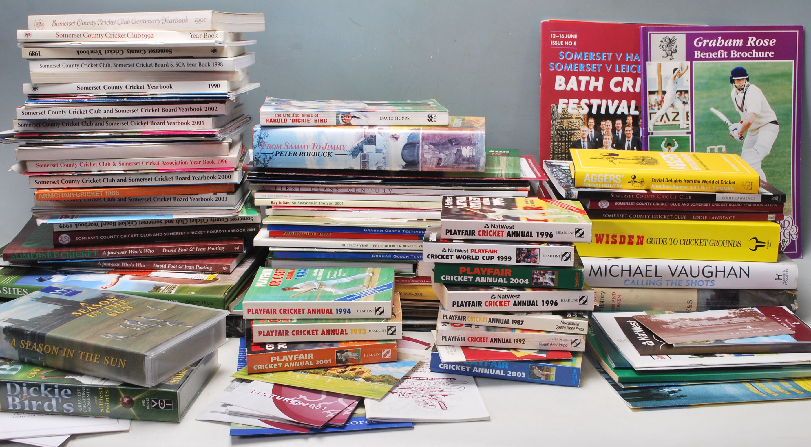 A LARGE QUANTITY OF CRICKET RELATED BOOKS, PROGRAMMES, BROCHURES, ETC