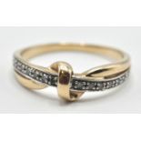 TWO TONE 9CT GOLD KNOT RING SET WITH WHITE STONES