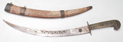 EARLY 20TH CENTURY ORIENTAL - ISLAMIC HAND CARVED DAGGER