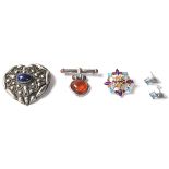 A group of three brooches to include a stamped 925 silver star shaped brooch having round cut,