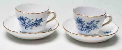 A PAIR OF LATE VICTORIAN 19TH CENTURY MEISSEN TEA CUPS AND SAUCERS