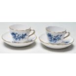 A PAIR OF LATE VICTORIAN 19TH CENTURY MEISSEN TEA CUPS AND SAUCERS