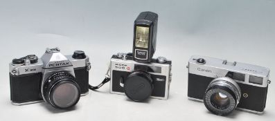 THREE VINTAGE 20TH CENTURY CAMERAS - CANON - PENTAX ASAHI - RICOH