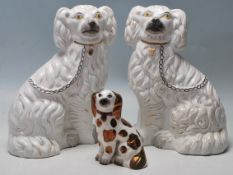 COLLECTION OF THREE MID CENTURY STAFFORDSHIRE PORCELAIN DOGS