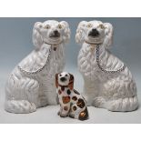 COLLECTION OF THREE MID CENTURY STAFFORDSHIRE PORCELAIN DOGS