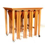 A VINTAGE 20TH CENTURY DANISH INSPIRED METAMORPHIC NEST OF TABLES