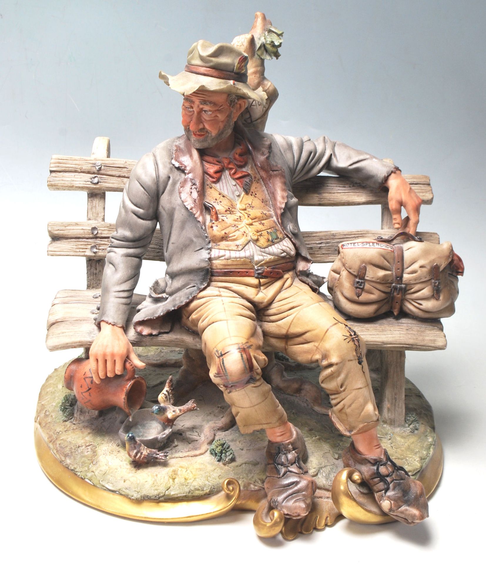 CAPODIMONTE PORCELIAN FIGURINE OF A TRAMP ON BENCH