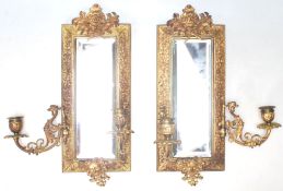 A PAIR OF VICTORIAN ANTIQUE CAST METAL GILDED SCONCE WALL MIRRORS