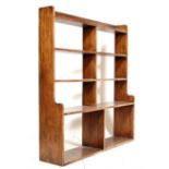 A 1930'S OAK LIBRARY WATERFALL OPEN BOOK CASE