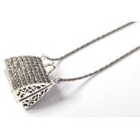 A STAMPED 925 SILVER PENDANT NECKLACE IN THE FORM OF A LADIES CLUTCH BAG.