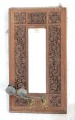 VICTORIAN 19TH CENTURY OAK HANGING MIRROR WITH CARVED DECORATION AND BRASS CANDLE HOLDER