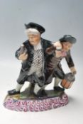 LATE VICTORIAN STAFFORDSHIRE FIGURINE OF THE DRUNKARDS