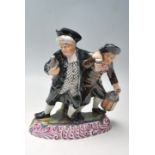 LATE VICTORIAN STAFFORDSHIRE FIGURINE OF THE DRUNKARDS