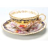 A 19TH CENTURY GEORGIAN COBALT BLUE AND GILT TEA CUP AND SAUCER