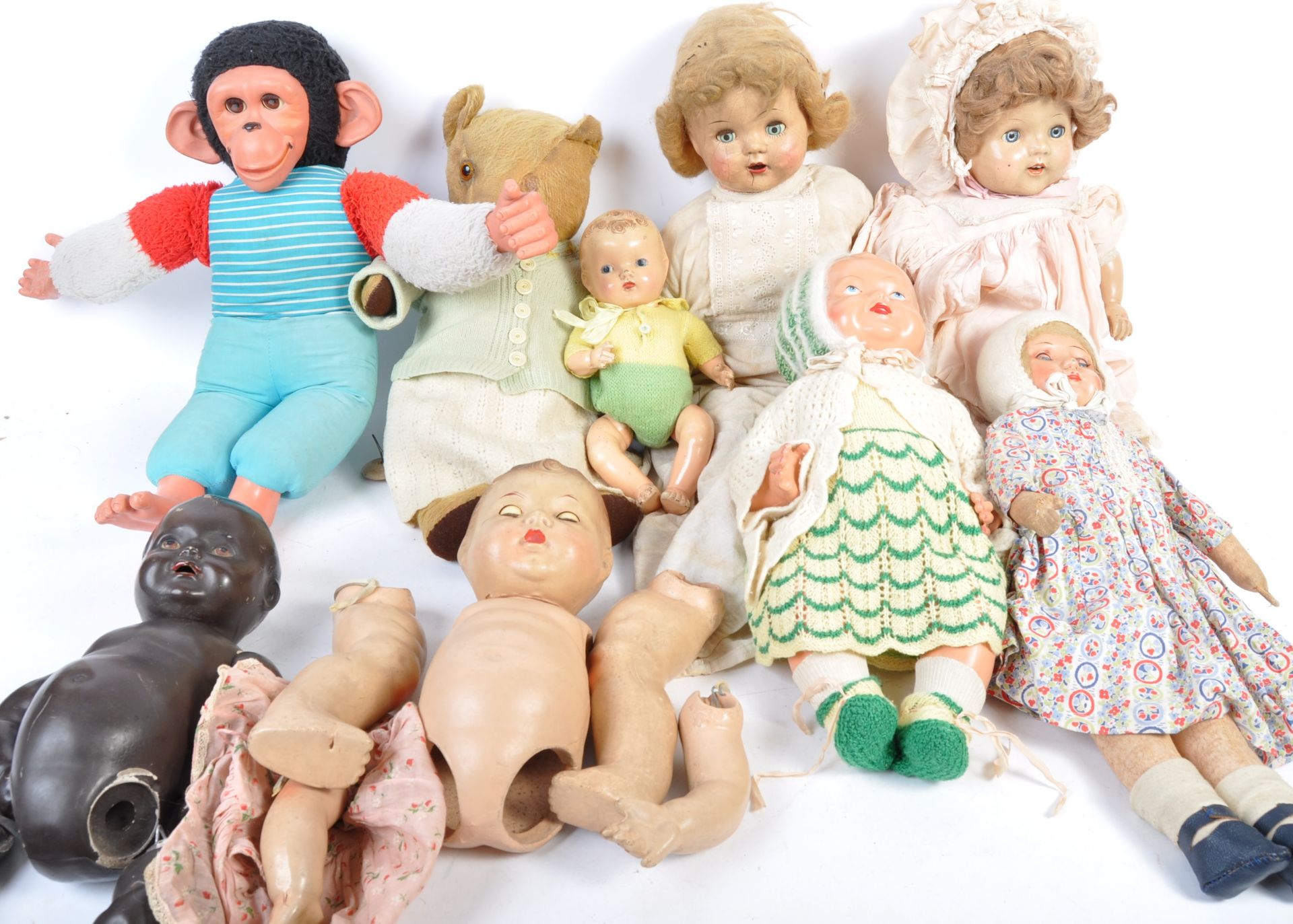 A COLLECTION OF COMPOSITION BODY DOLLS AND TEDDY BEARS