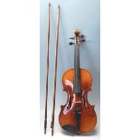 An antique early 20th Century 3/4 size violin by N
