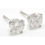 A PAIR OF STAMPED 14K WHITE GOLD DIAMOND STUD EARR
